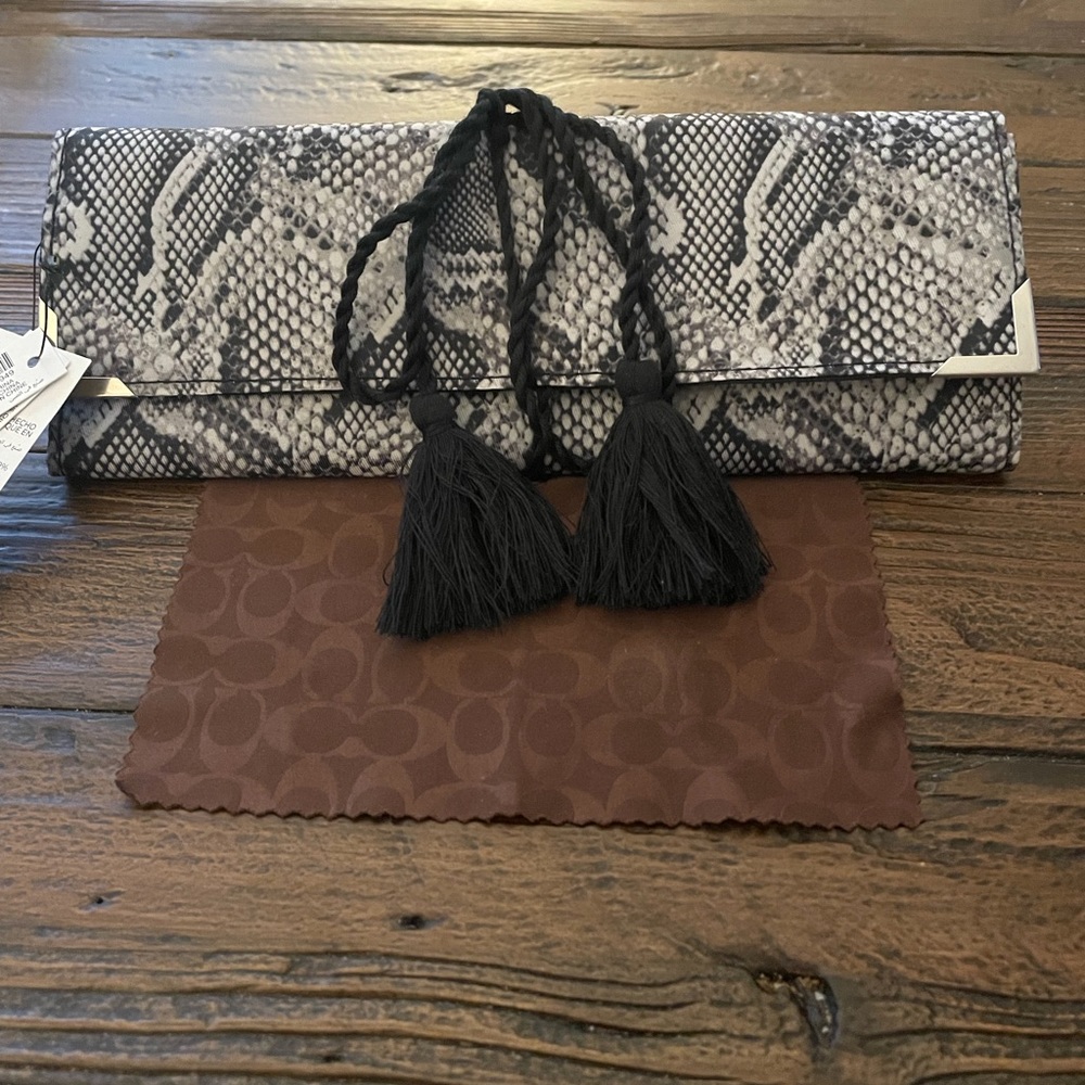 NWT bifold roll up jewelry holder.